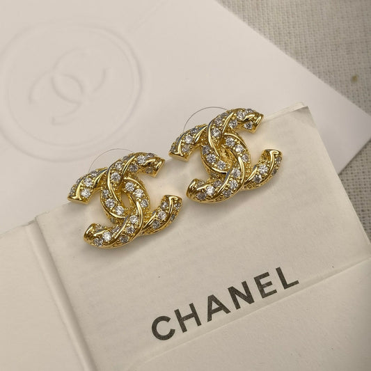 Clous d'oreilles logo étincelants en zircon