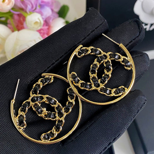 Boucles d'oreilles en cuir noir et ton or