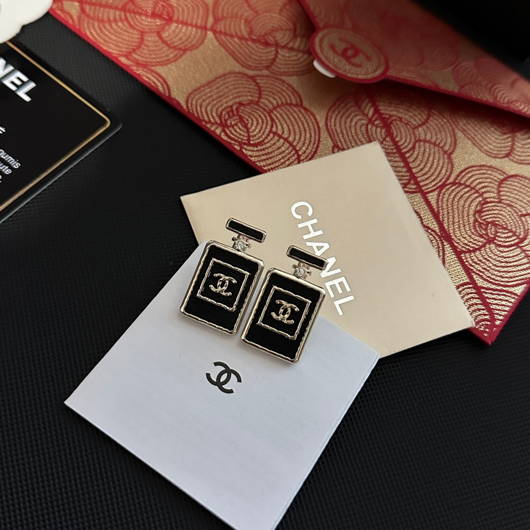 Pendientes de frasco de perfume negro