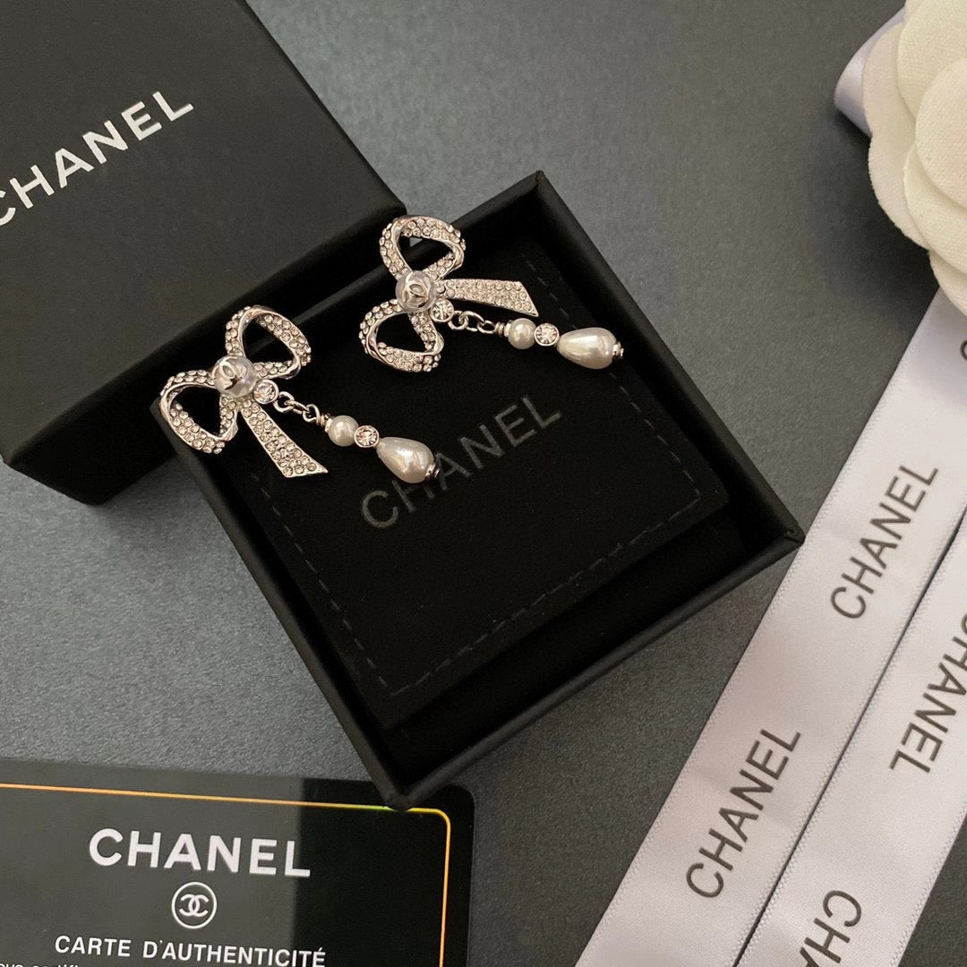 Pendientes de lazo con diamantes de cristal y temperamento