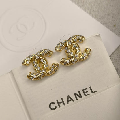 Clous d'oreilles logo étincelants en zircon