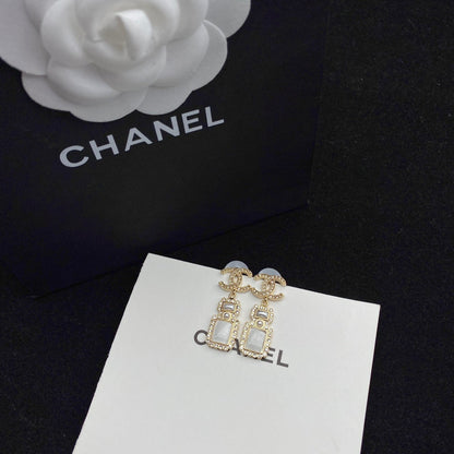 Boucles d'oreilles pendantes élégantes en forme de flacon de parfum