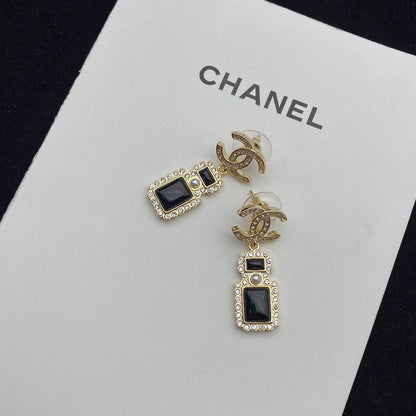 Boucles d'oreilles pendantes élégantes en forme de flacon de parfum