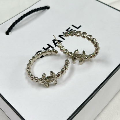 Boucles d'oreilles créoles logo en cristal