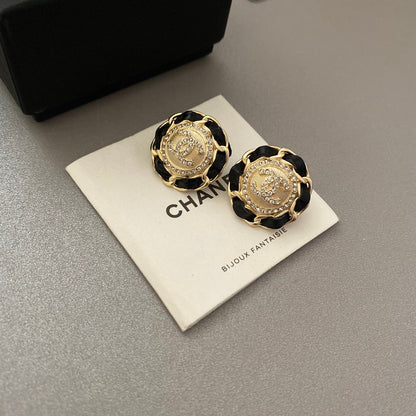 Boucles d'oreilles en cuir noir et doré