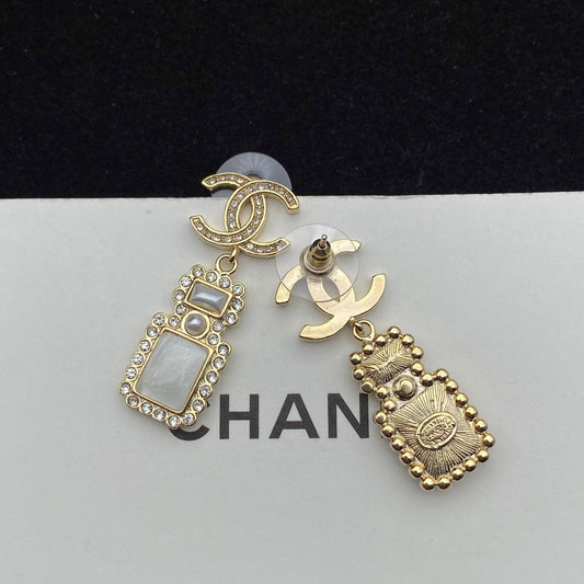 Boucles d'oreilles pendantes élégantes en forme de flacon de parfum