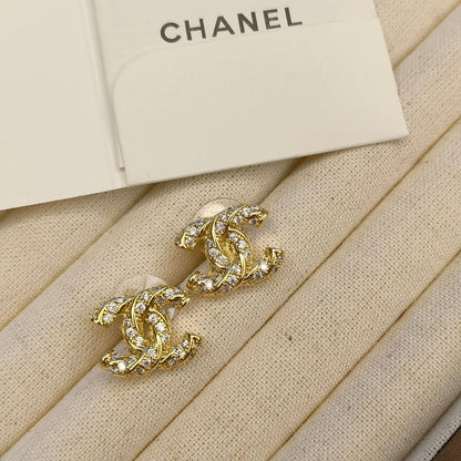 Clous d'oreilles logo étincelants en zircon