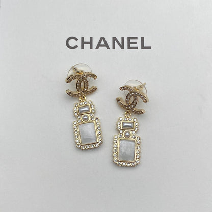 Boucles d'oreilles pendantes élégantes en forme de flacon de parfum