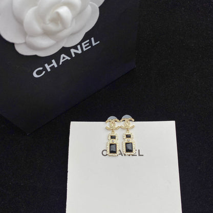 Boucles d'oreilles pendantes élégantes en forme de flacon de parfum