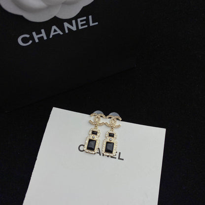 Boucles d'oreilles pendantes élégantes en forme de flacon de parfum