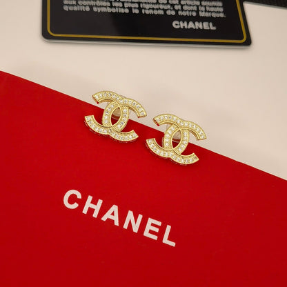 Boucles d'oreilles élégantes en argent et or avec logo