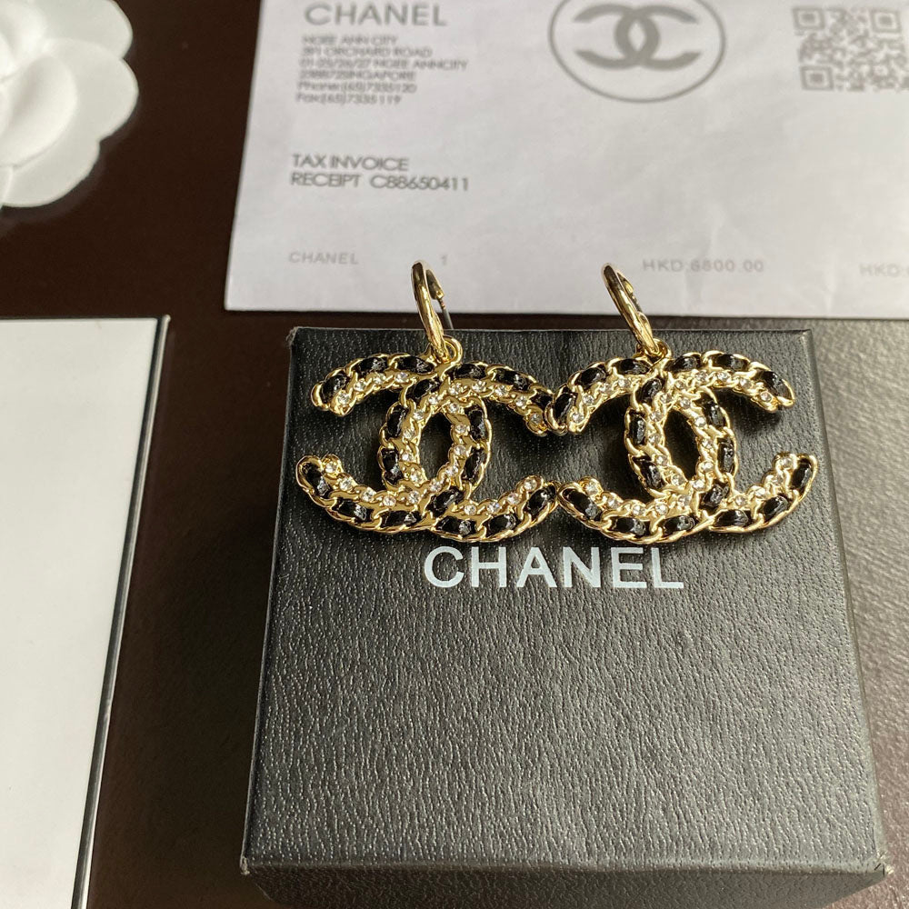 Pendientes colgantes de cuero negro y dorado