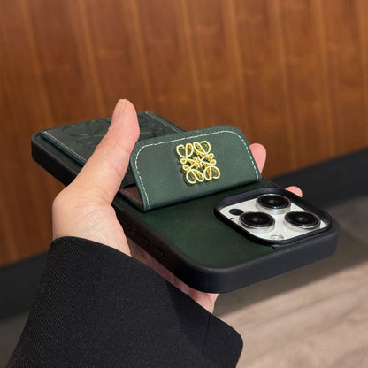 Estuche monedero de cuero repujado