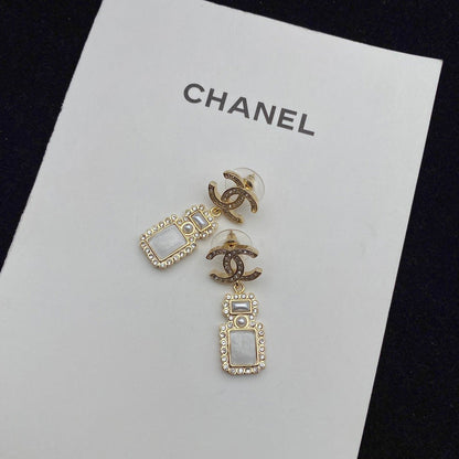 Boucles d'oreilles pendantes élégantes en forme de flacon de parfum