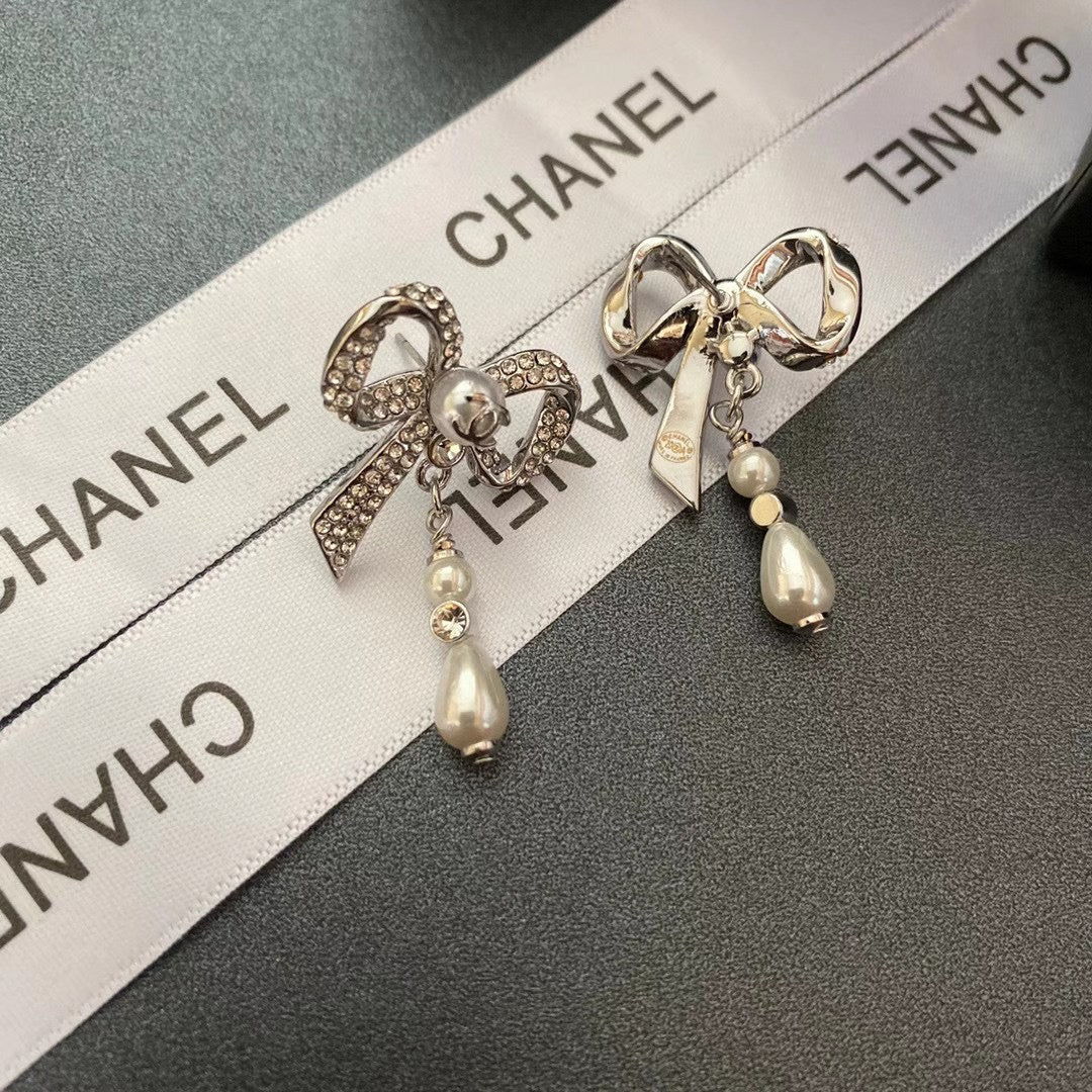 Pendientes de lazo con diamantes de cristal y temperamento