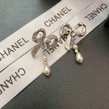 Pendientes de lazo con diamantes de cristal y temperamento