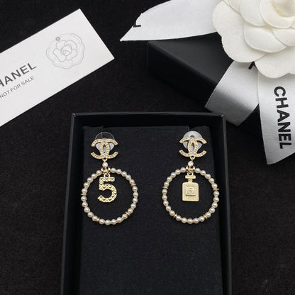 Boucles d'oreilles pendantes Perle et flacon de parfum Lucky 5