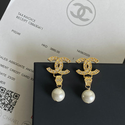 Boucles d'oreilles pendantes diamant et perle