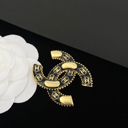 Broche en laiton avec logo vintage