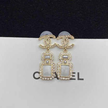 Boucles d'oreilles pendantes élégantes en forme de flacon de parfum