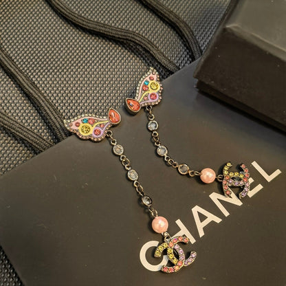 Boucles d'oreilles papillon en cristal coloré