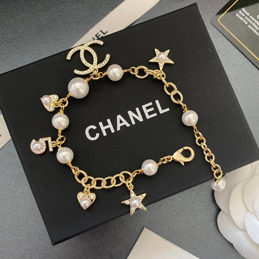 Bracelet avec pendentif cœur étoile et perle