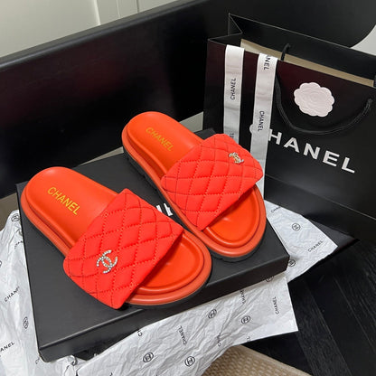 Pantuflas con el logotipo de diamante