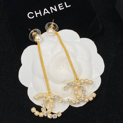 Boucles d'oreilles pendantes en chaîne avec perles et diamants