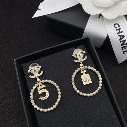 Boucles d'oreilles pendantes Perle et flacon de parfum Lucky 5