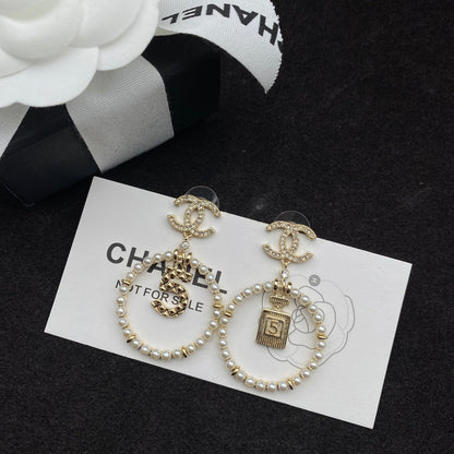 Boucles d'oreilles pendantes Perle et flacon de parfum Lucky 5