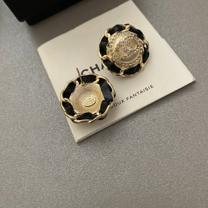 Boucles d'oreilles en cuir noir et doré