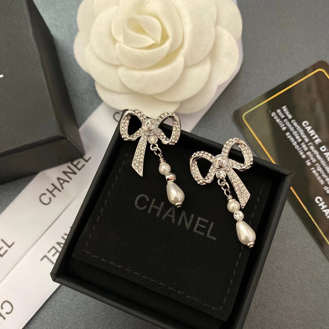 Pendientes de lazo con diamantes de cristal y temperamento