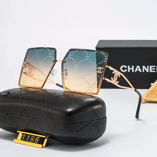Lunettes de soleil rétro avec monture en métal et lettres en filigrane