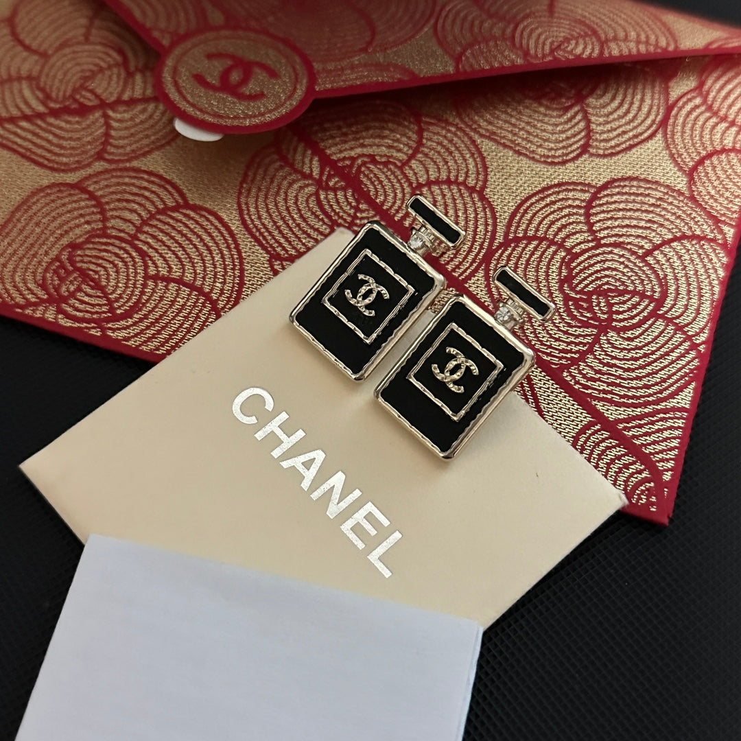 Pendientes de frasco de perfume negro