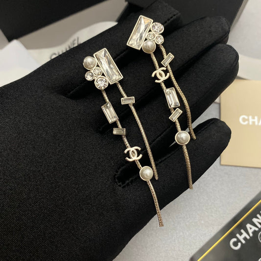 Boucles d'oreilles à élément pompon