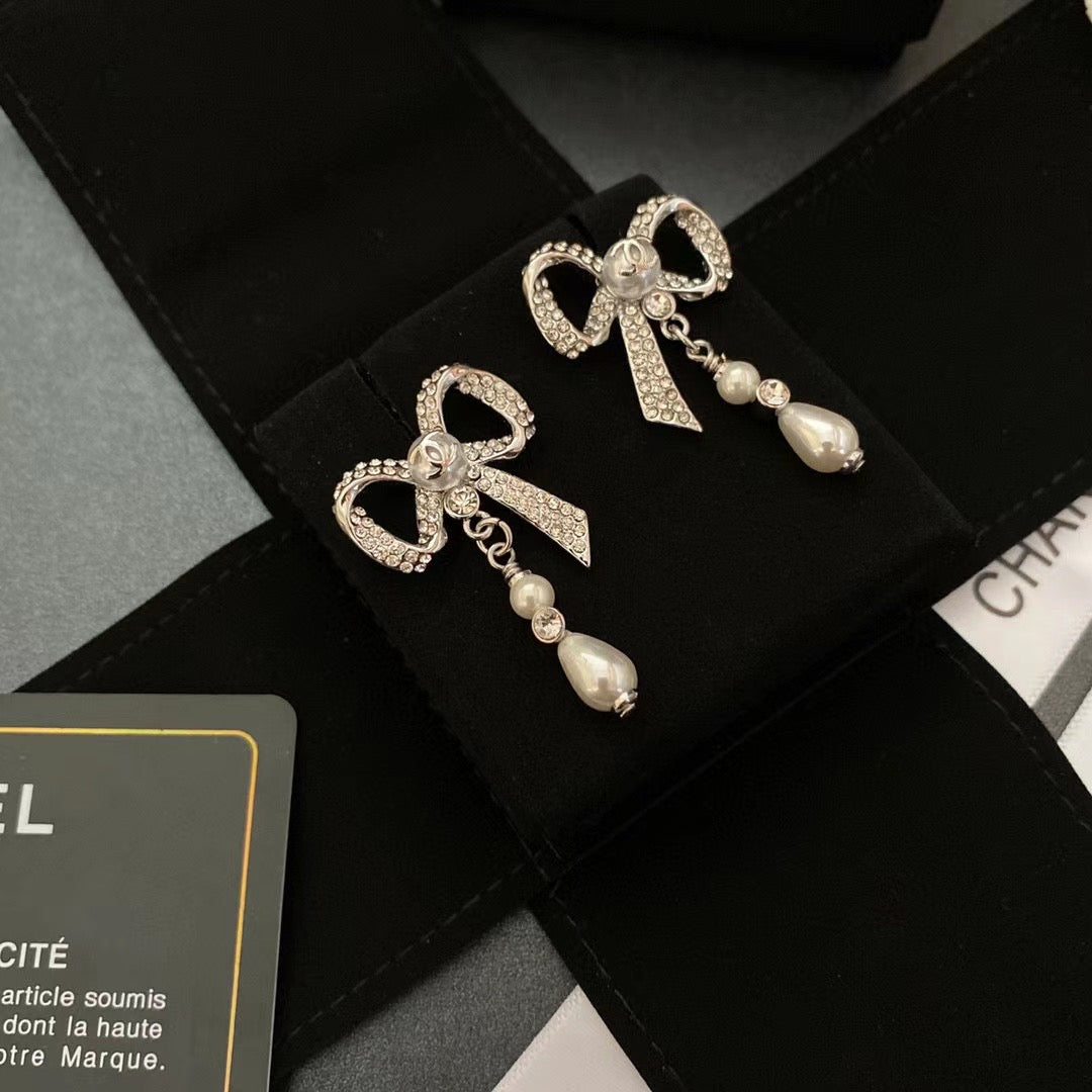 Pendientes de lazo con diamantes de cristal y temperamento