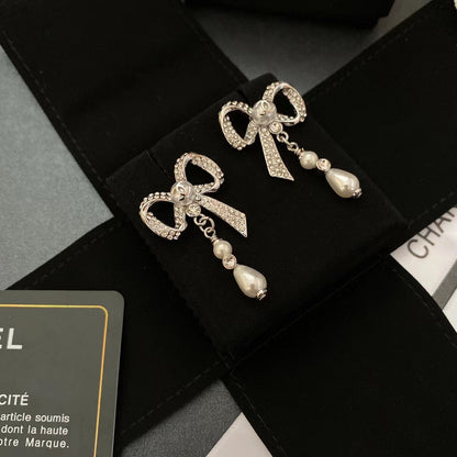 Pendientes de lazo con diamantes de cristal y temperamento