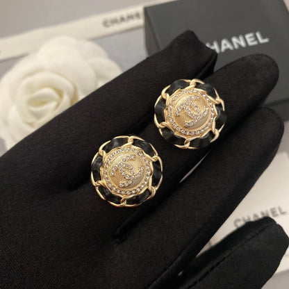Boucles d'oreilles en cuir noir et doré