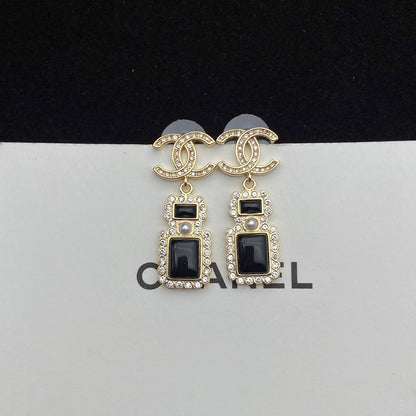 Boucles d'oreilles pendantes élégantes en forme de flacon de parfum