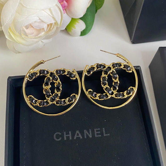 Boucles d'oreilles en cuir noir et ton or
