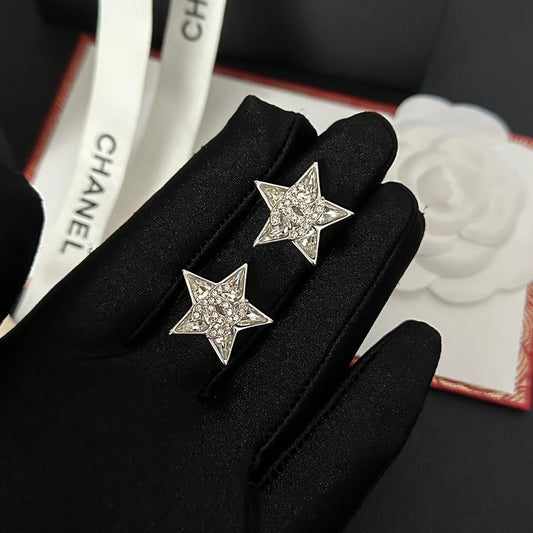 Boucles d'oreilles étoile en strass argentés