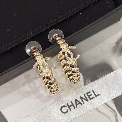 Boucles d'oreilles créoles logo en cristal