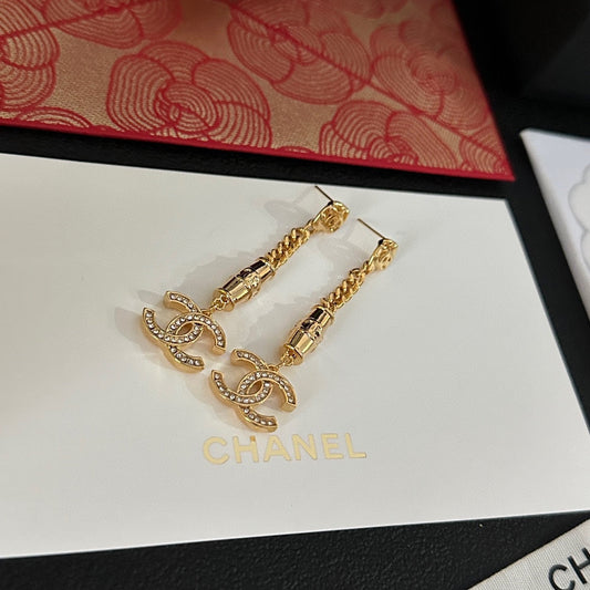Boucles d'oreilles pendantes en strass doré