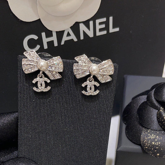 Boucles d'oreilles nœud zircon scintillant