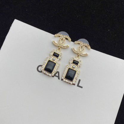 Boucles d'oreilles pendantes élégantes en forme de flacon de parfum