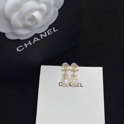 Boucles d'oreilles pendantes élégantes en forme de flacon de parfum