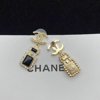 Boucles d'oreilles pendantes élégantes en forme de flacon de parfum