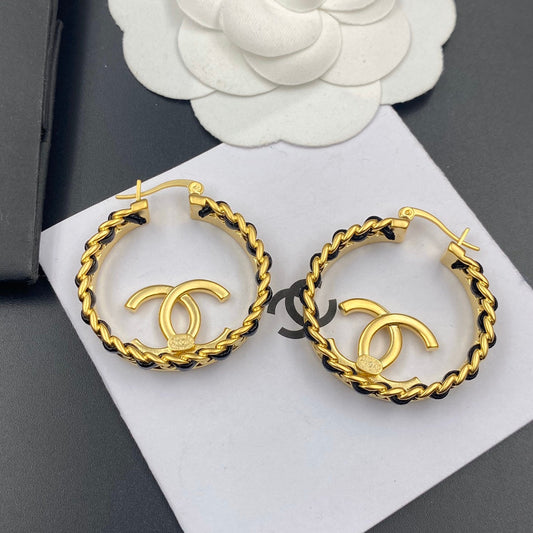 Boucles d'oreilles créoles en cuir tressé