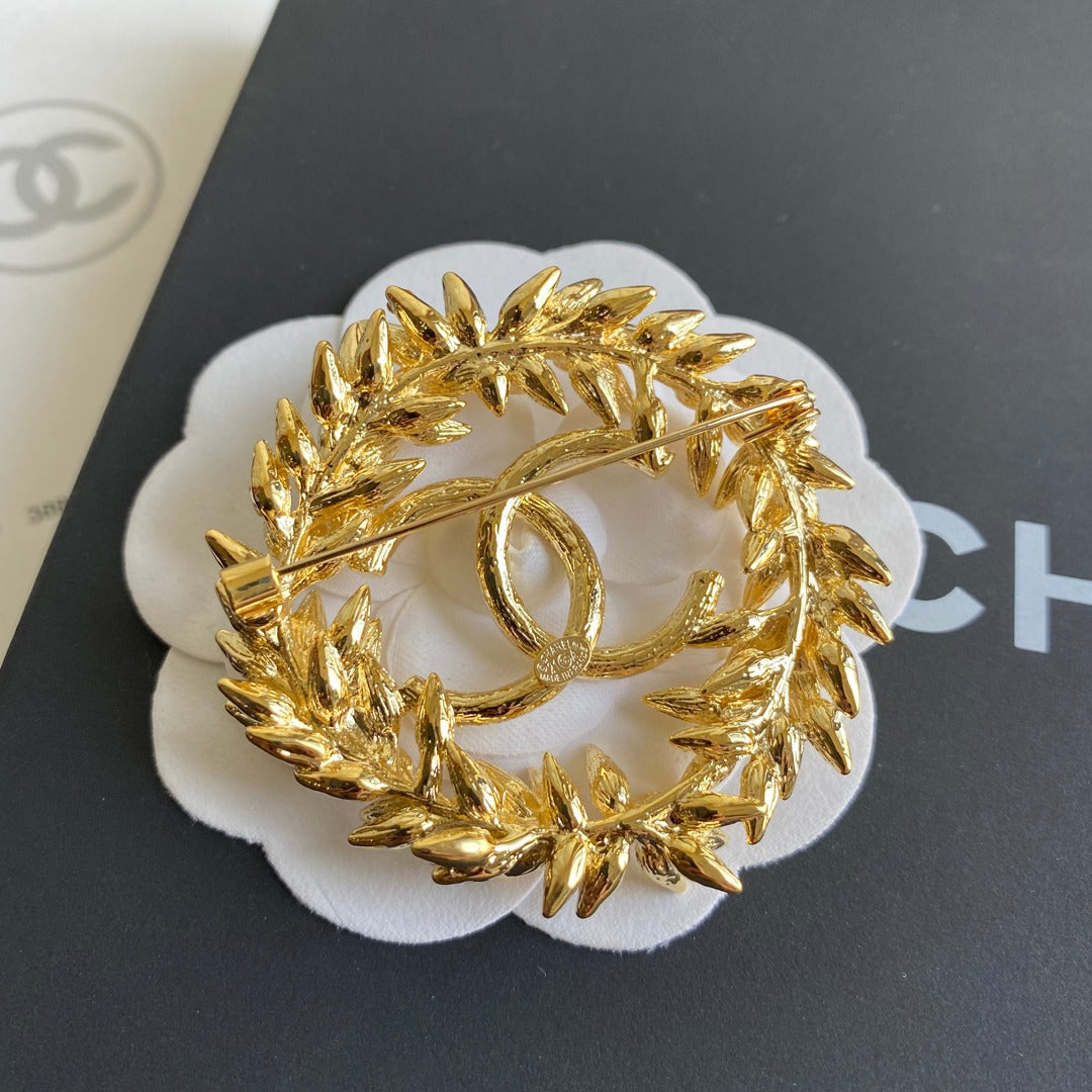 Broche de espiga de arroz dorada