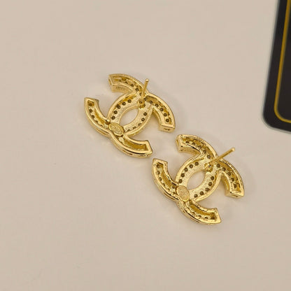 Boucles d'oreilles élégantes en argent et or avec logo
